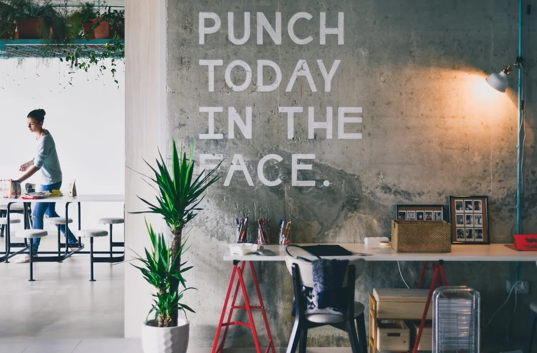 A contemporary workspace showcasing a laptop, tablet, and smartphones, ideal for tech and freelance use.